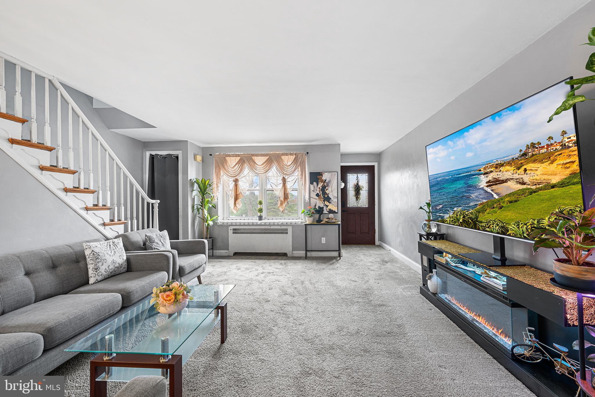 223 St Laurence Road Upper Darby, PA 19082 - Photo 5 of 32 a living room with furniture and a flat screen tv