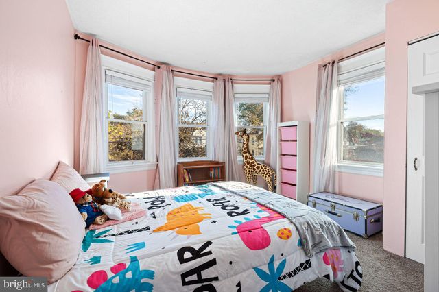 a bedroom with bed and a window