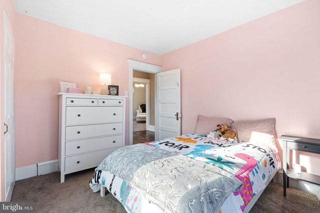 a bedroom with a bed and a closet