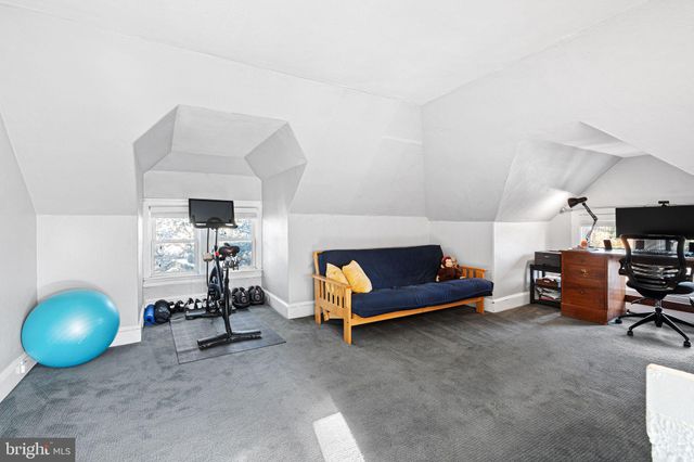 a living room with furniture and a lamp