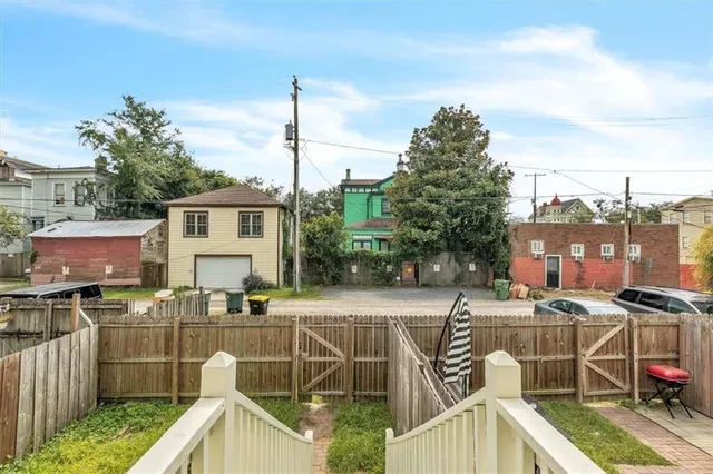 a view of a patio with couches chairs and potted plants