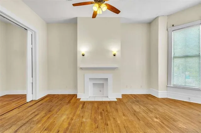 a bedroom with a bed and a fireplace