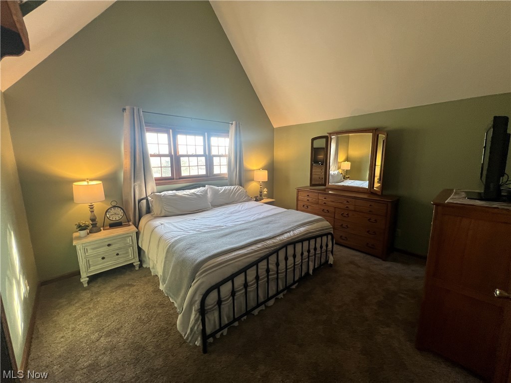 4512 Tabor Ridge Road Northeast Mineral City, OH 44656 - Photo 25 of 44 Carpeted bedroom with high vaulted ceiling