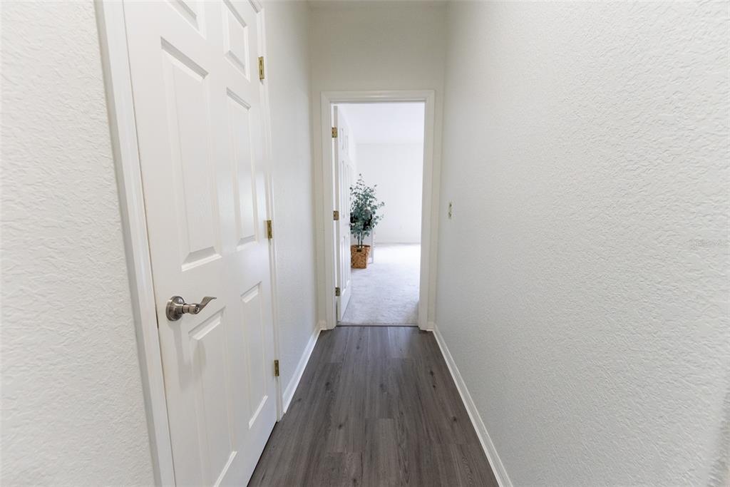12855 Southeast 92nd Court Road Summerfield, FL 34491 - Photo 25 of 61 a view of a hallway with wooden floor and closet