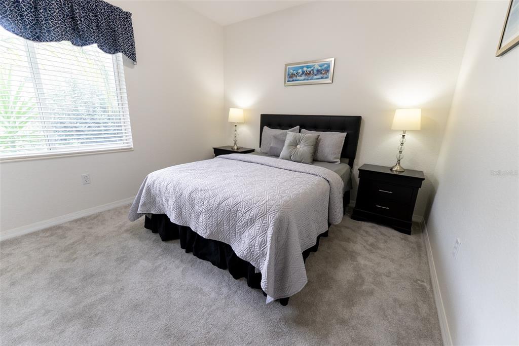 12855 Southeast 92nd Court Road Summerfield, FL 34491 - Photo 27 of 61 a bedroom with a bed and a window
