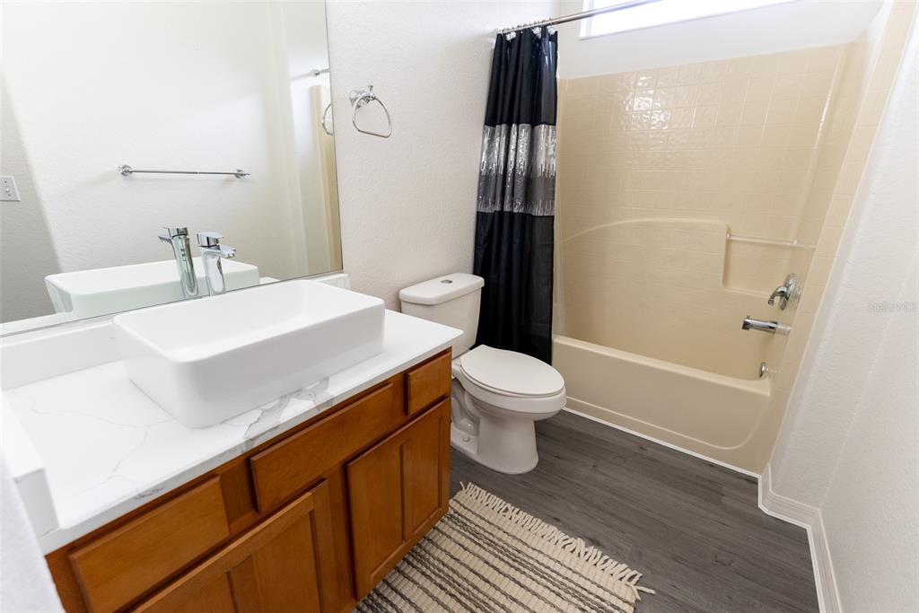 12855 Southeast 92nd Court Road Summerfield, FL 34491 - Photo 30 of 61 a bathroom with a sink and a toilet