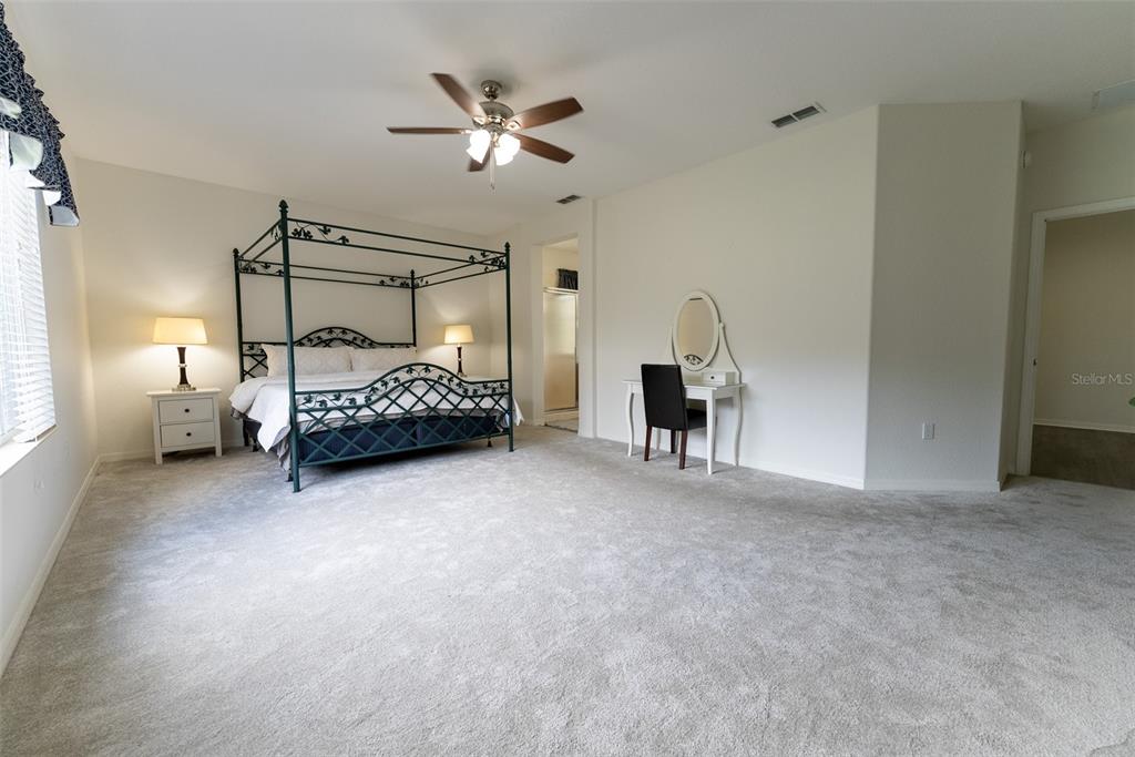 12855 Southeast 92nd Court Road Summerfield, FL 34491 - Photo 36 of 61 a bedroom with bed and window
