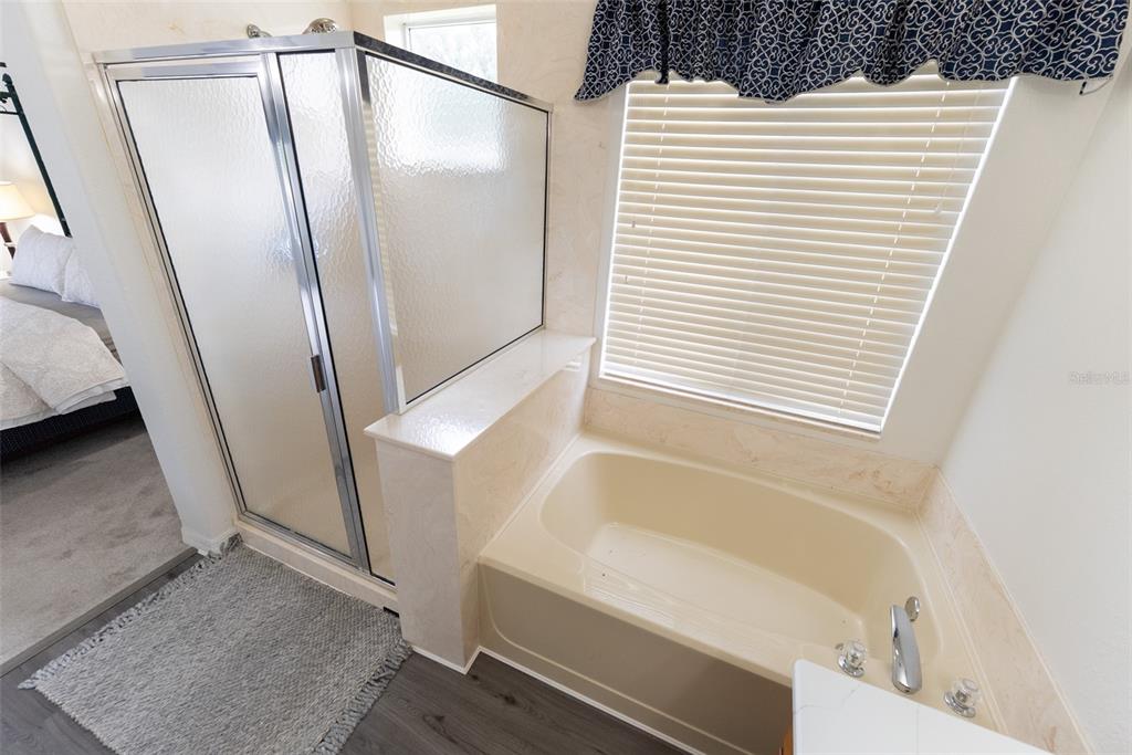 12855 Southeast 92nd Court Road Summerfield, FL 34491 - Photo 43 of 61 a bathroom with a bathtub and a shower