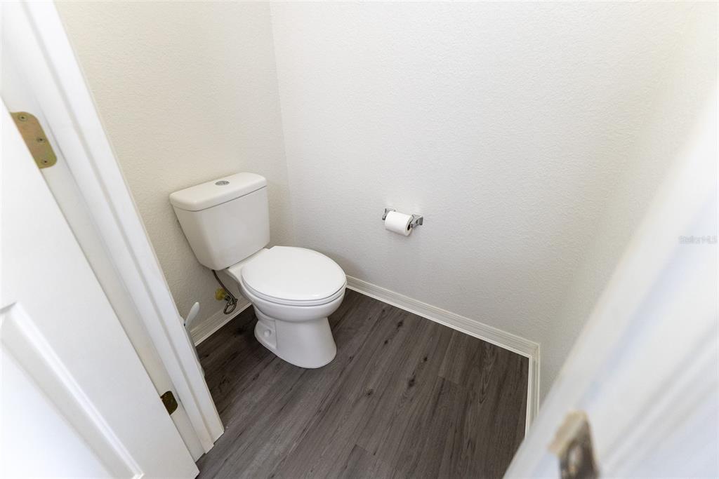 12855 Southeast 92nd Court Road Summerfield, FL 34491 - Photo 46 of 61 a white toilet sitting next to a sink