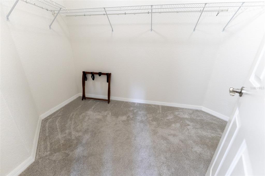 12855 Southeast 92nd Court Road Summerfield, FL 34491 - Photo 47 of 61 a view of a room with racks on the wall