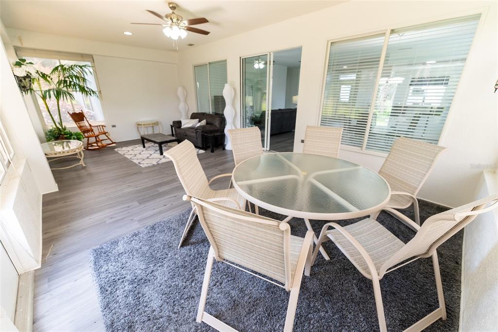 12855 Southeast 92nd Court Road Summerfield, FL 34491 - Photo 49 of 61 a dining room with furniture and wooden floor