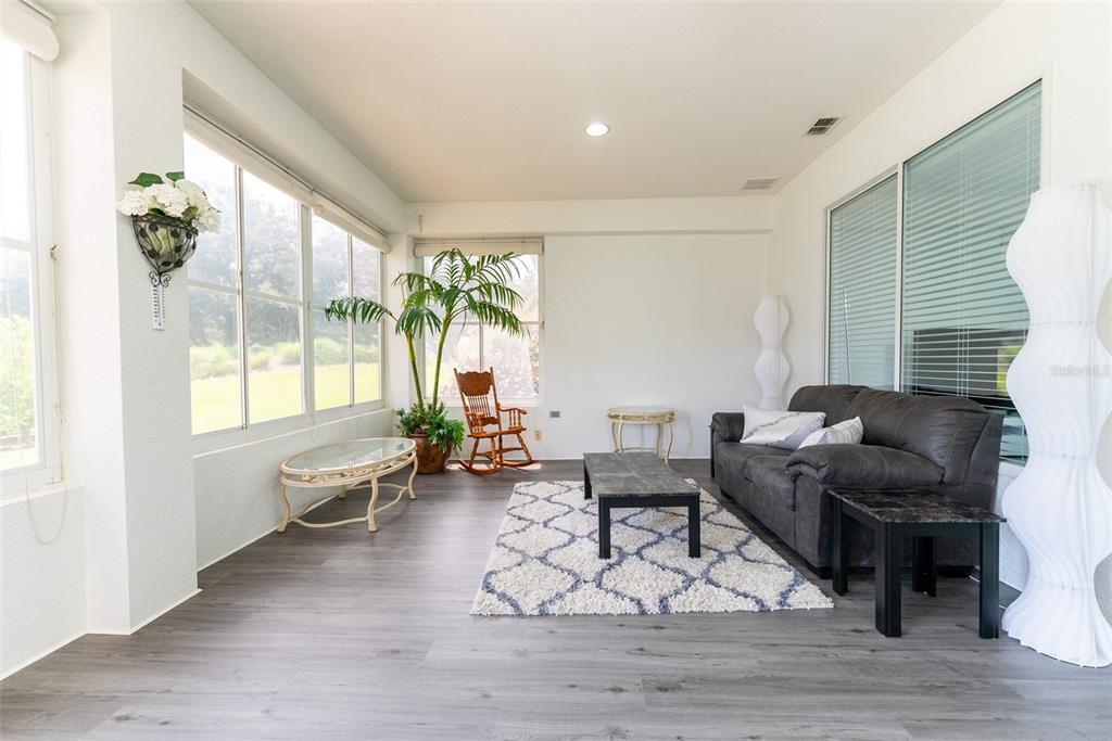 12855 Southeast 92nd Court Road Summerfield, FL 34491 - Photo 50 of 61 a living room with furniture and a large window