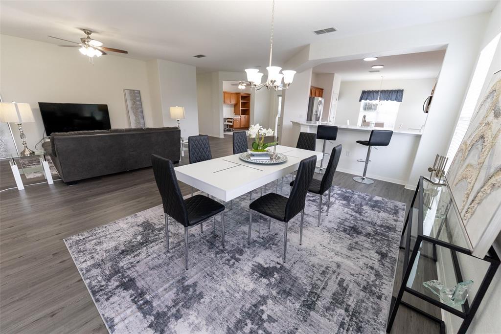 12855 Southeast 92nd Court Road Summerfield, FL 34491 - Photo 10 of 61 a view of a dining room with furniture