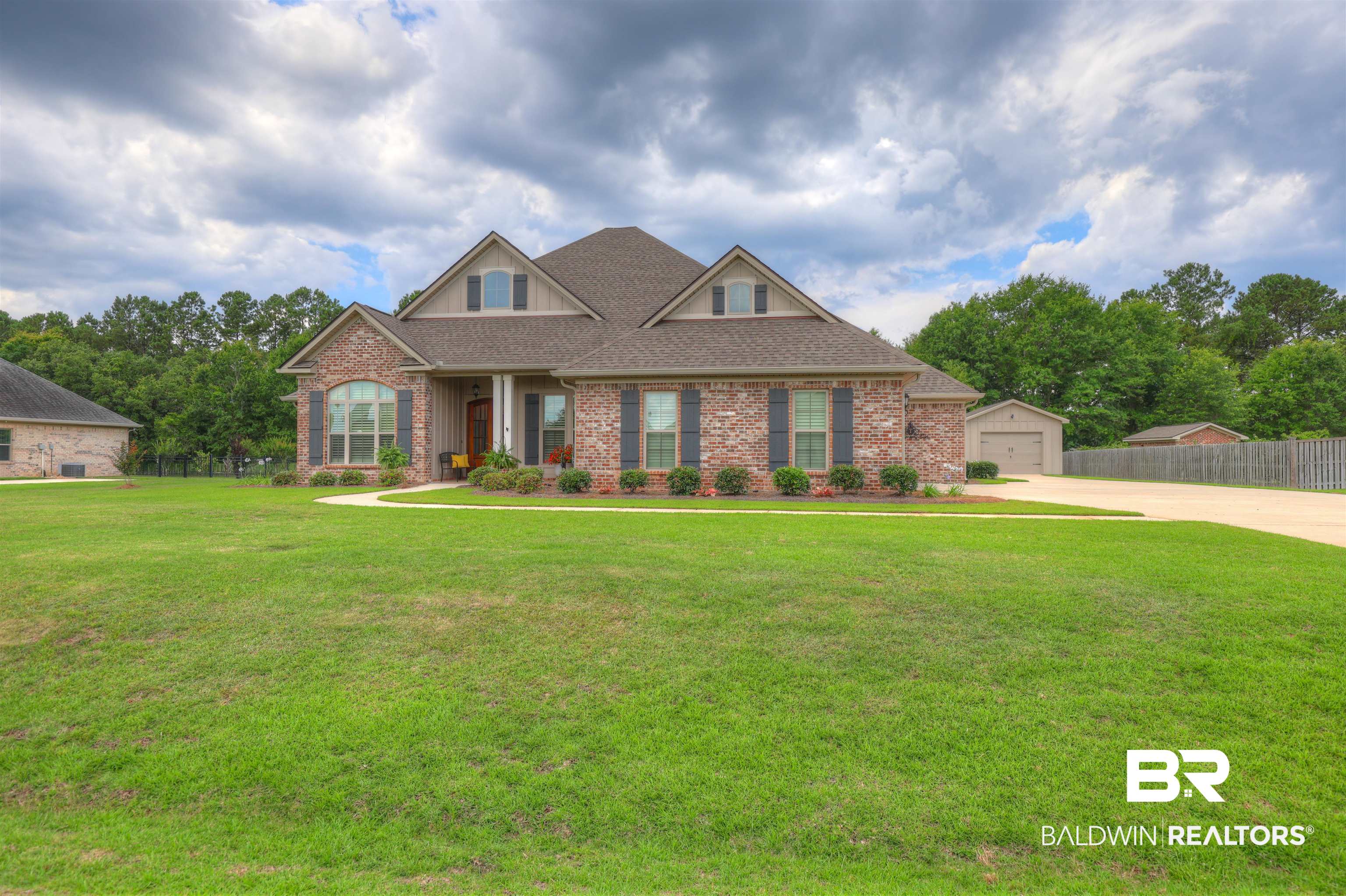 10588 Leesburg Pike Daphne, AL 36526 - Photo 2 of 29 Craftsman-style home with a garage and a front lawn