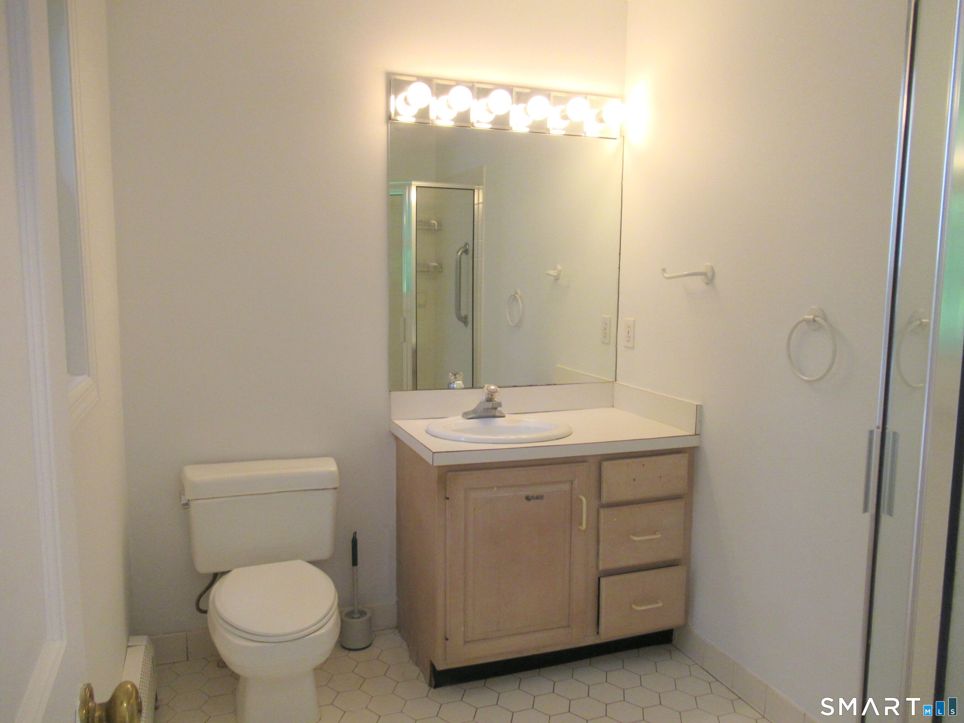 11 Burnt Swamp Road Woodbridge, CT 06525 - Photo 23 of 29 a bathroom with a toilet sink and mirror