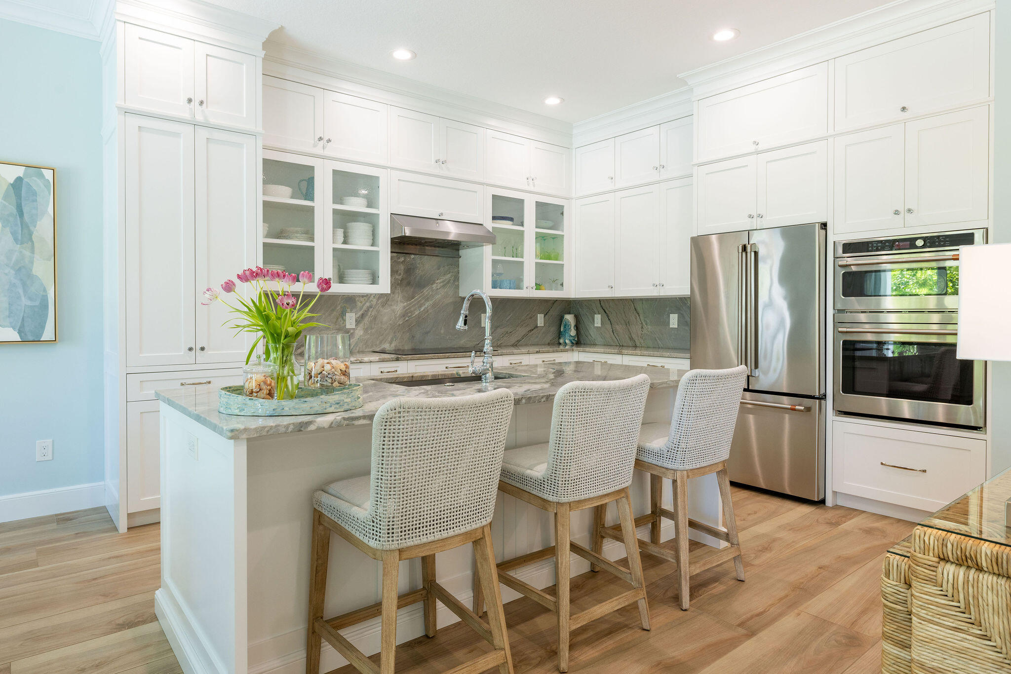 1037 Duval Street Jupiter, FL 33458 - Photo 13 of 47 a kitchen with stainless steel appliances kitchen island granite countertop a table and chairs