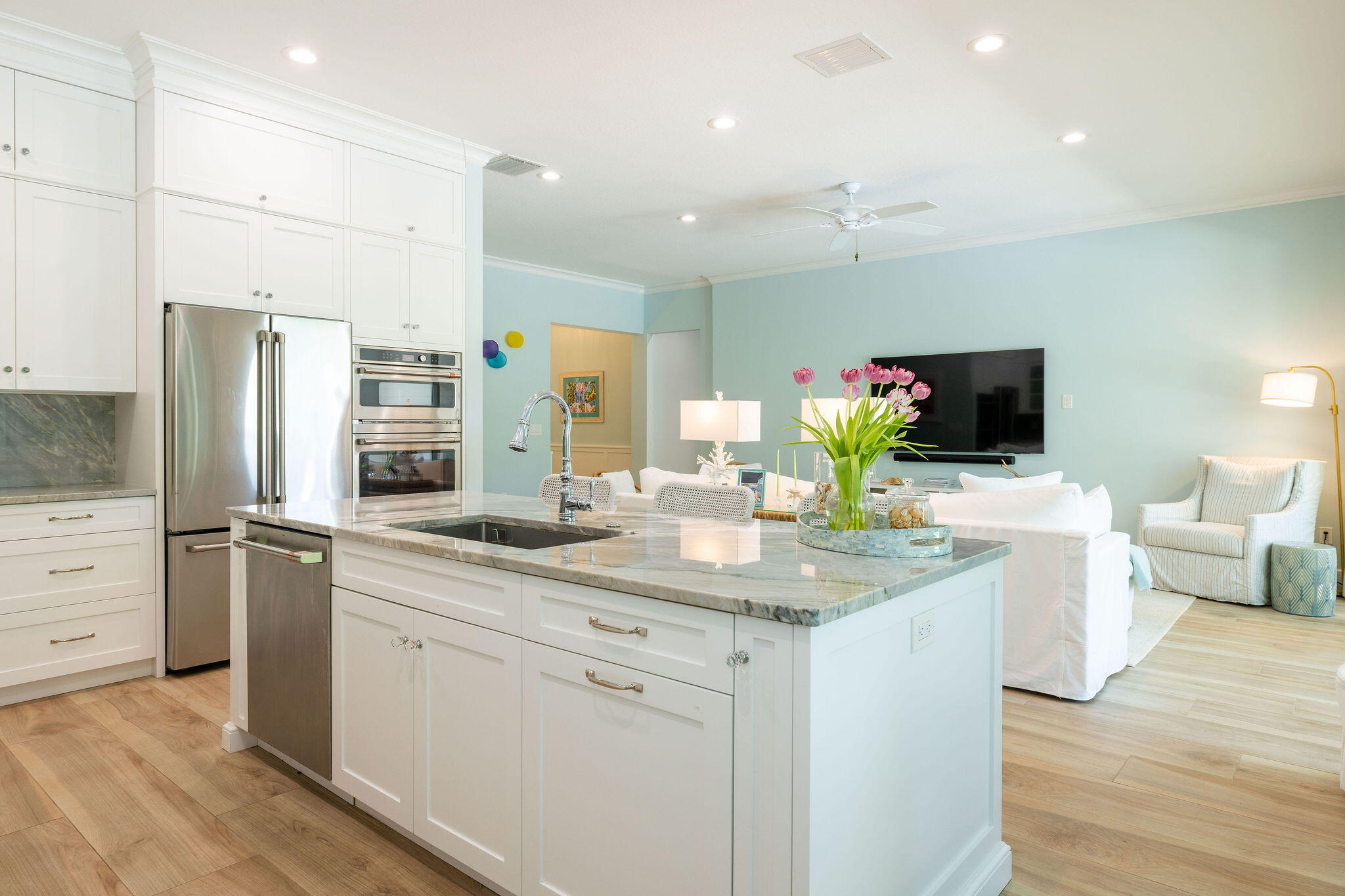 1037 Duval Street Jupiter, FL 33458 - Photo 16 of 47 a kitchen with stainless steel appliances a sink dishwasher a refrigerator and a flat screen tv