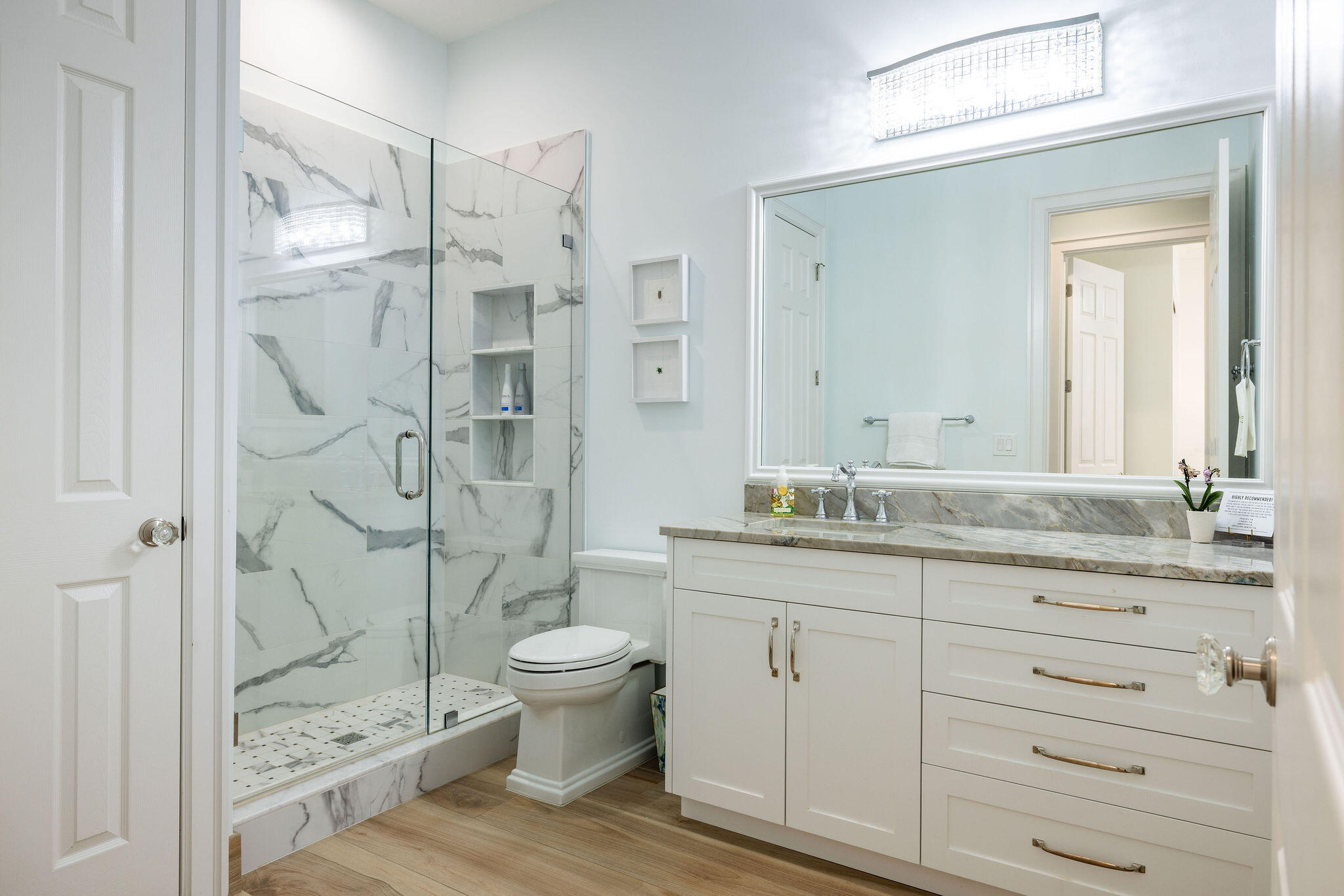 1037 Duval Street Jupiter, FL 33458 - Photo 29 of 47 a bathroom with a granite countertop sink a toilet and shower