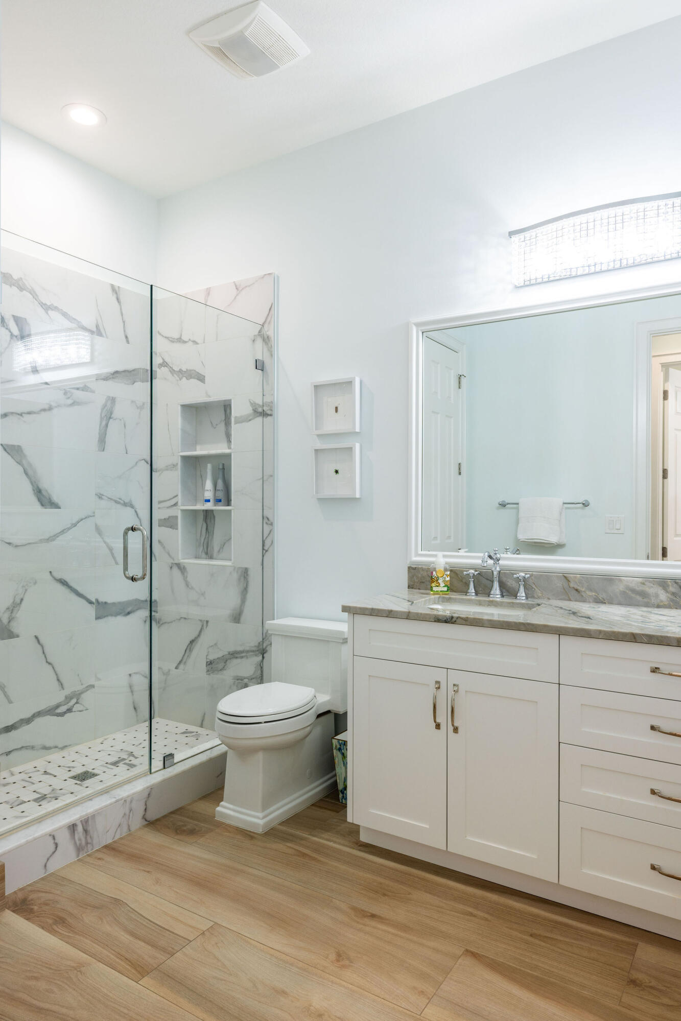 1037 Duval Street Jupiter, FL 33458 - Photo 30 of 47 a bathroom with a granite countertop sink toilet and shower