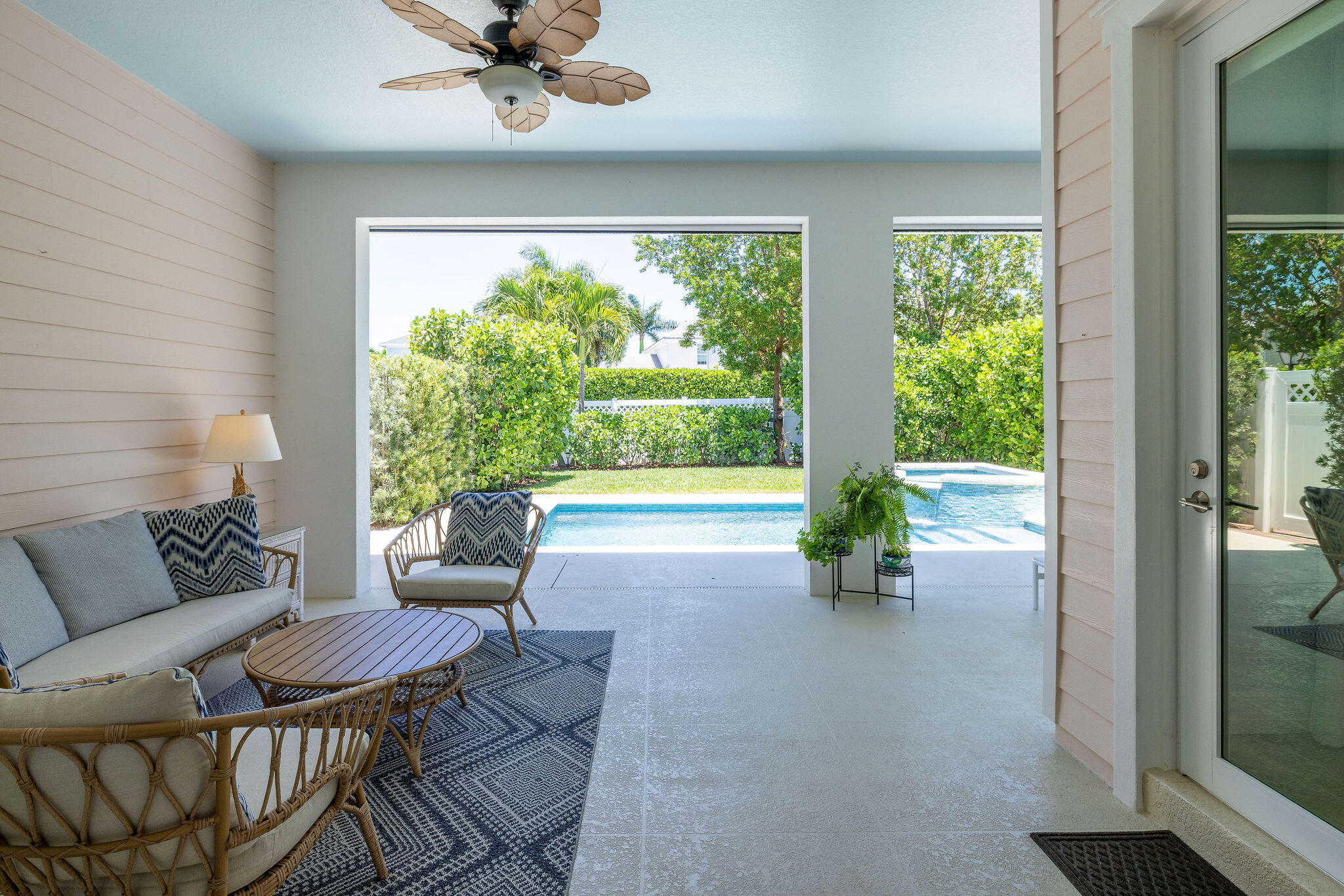 1037 Duval Street Jupiter, FL 33458 - Photo 32 of 47 a living room with furniture and a floor to ceiling window