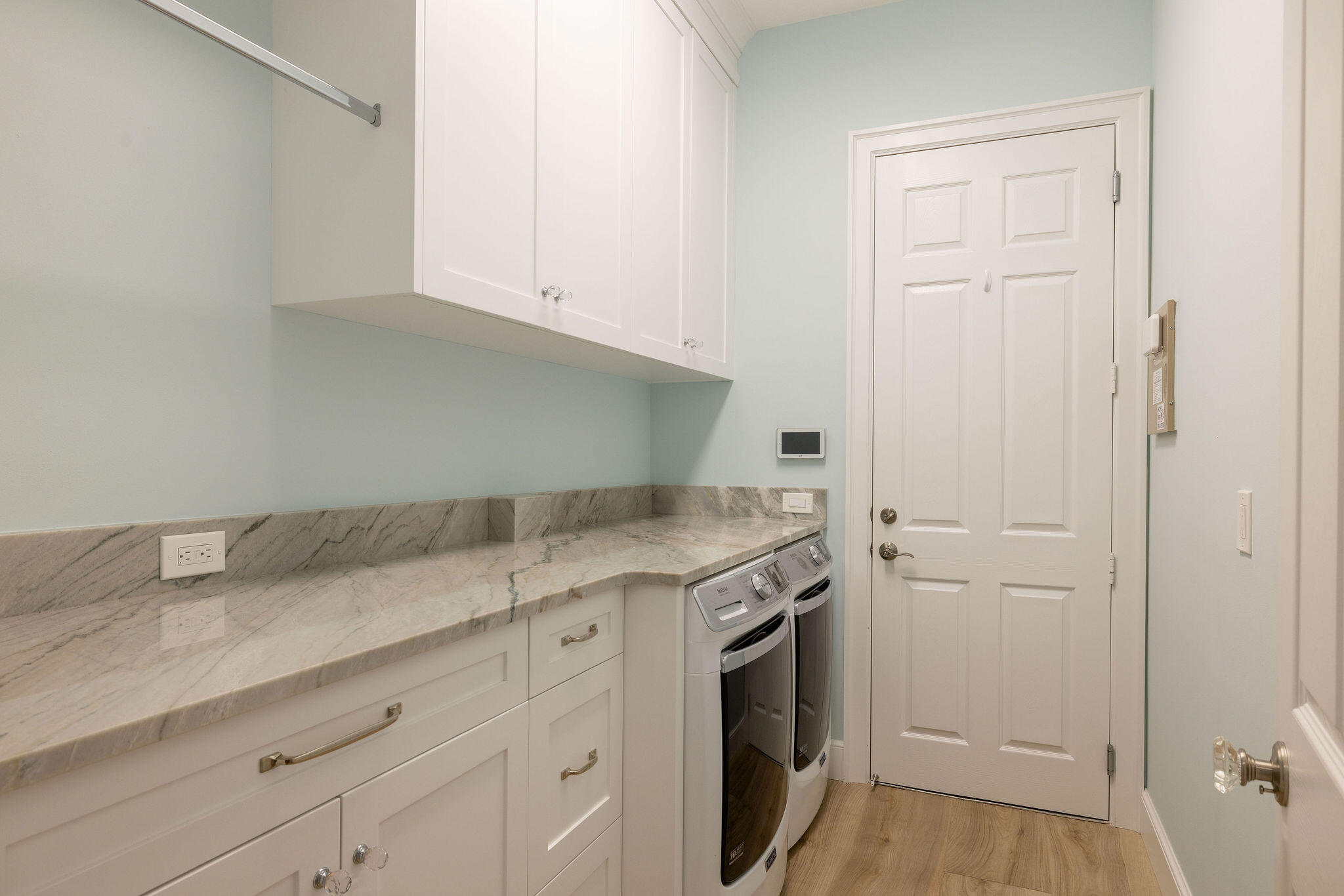 1037 Duval Street Jupiter, FL 33458 - Photo 41 of 47 a utility room with granite countertop cabinets washer and dryer