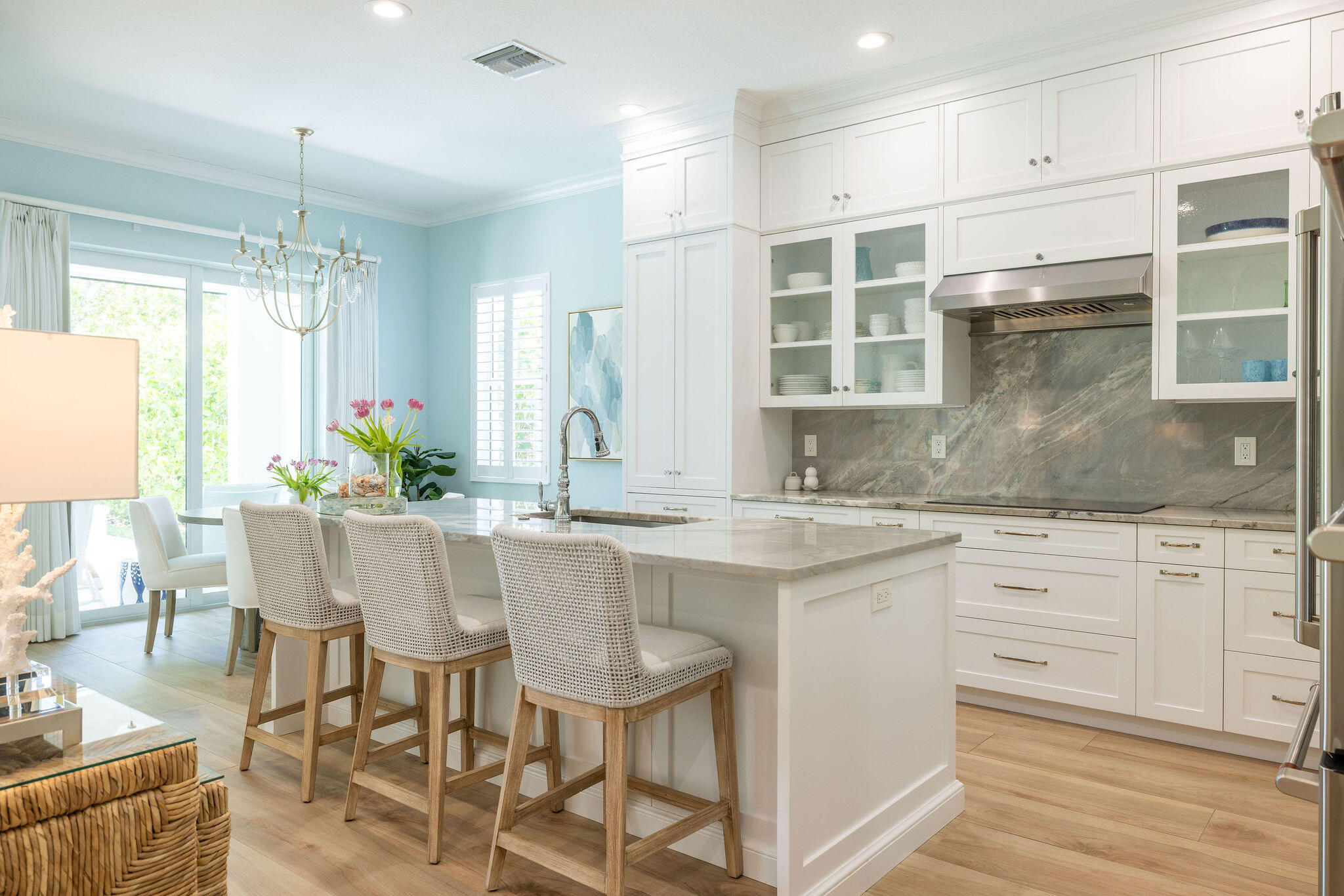 1037 Duval Street Jupiter, FL 33458 - Photo 10 of 47 a kitchen with granite countertop white cabinets and chairs