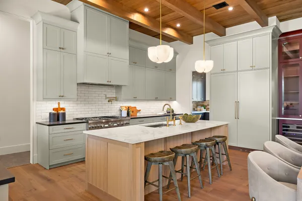 a kitchen with a sink stove and cabinets