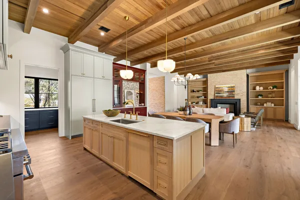 a kitchen with a sink cabinets and window