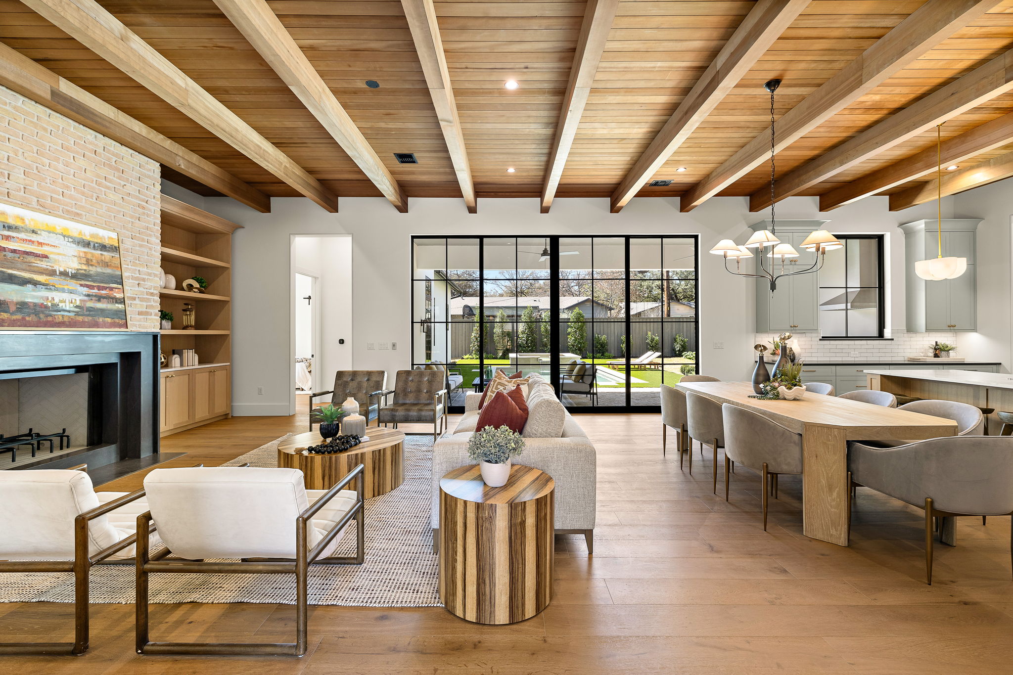 5906 Rickey Drive Austin, TX 78757 - Photo 2 of 38 a living room with fireplace furniture and a large window