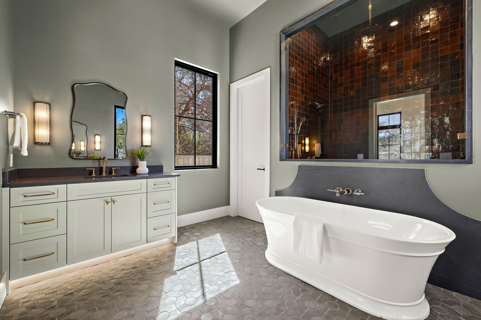 5906 Rickey Drive Austin, TX 78757 - Photo 21 of 38 a spacious bathroom with a tub sink and mirror