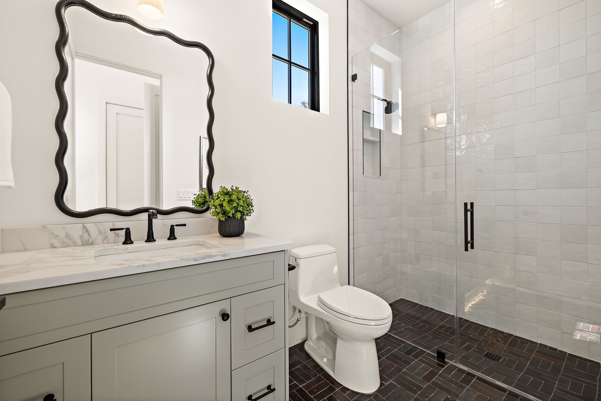 5906 Rickey Drive Austin, TX 78757 - Photo 24 of 38 a bathroom with a toilet sink and mirror