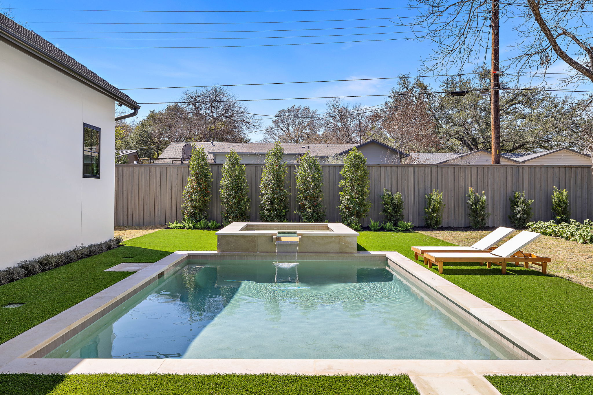 5906 Rickey Drive Austin, TX 78757 - Photo 36 of 38 a view of a house with backyard swimming pool and sitting area