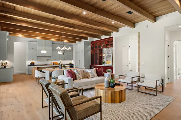 a living room with furniture and a potted plant