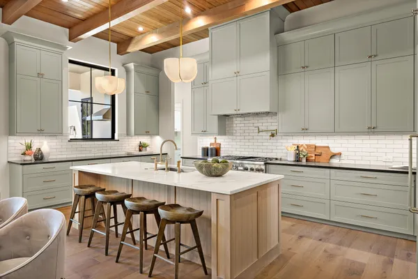 a kitchen with cabinets a sink and appliances