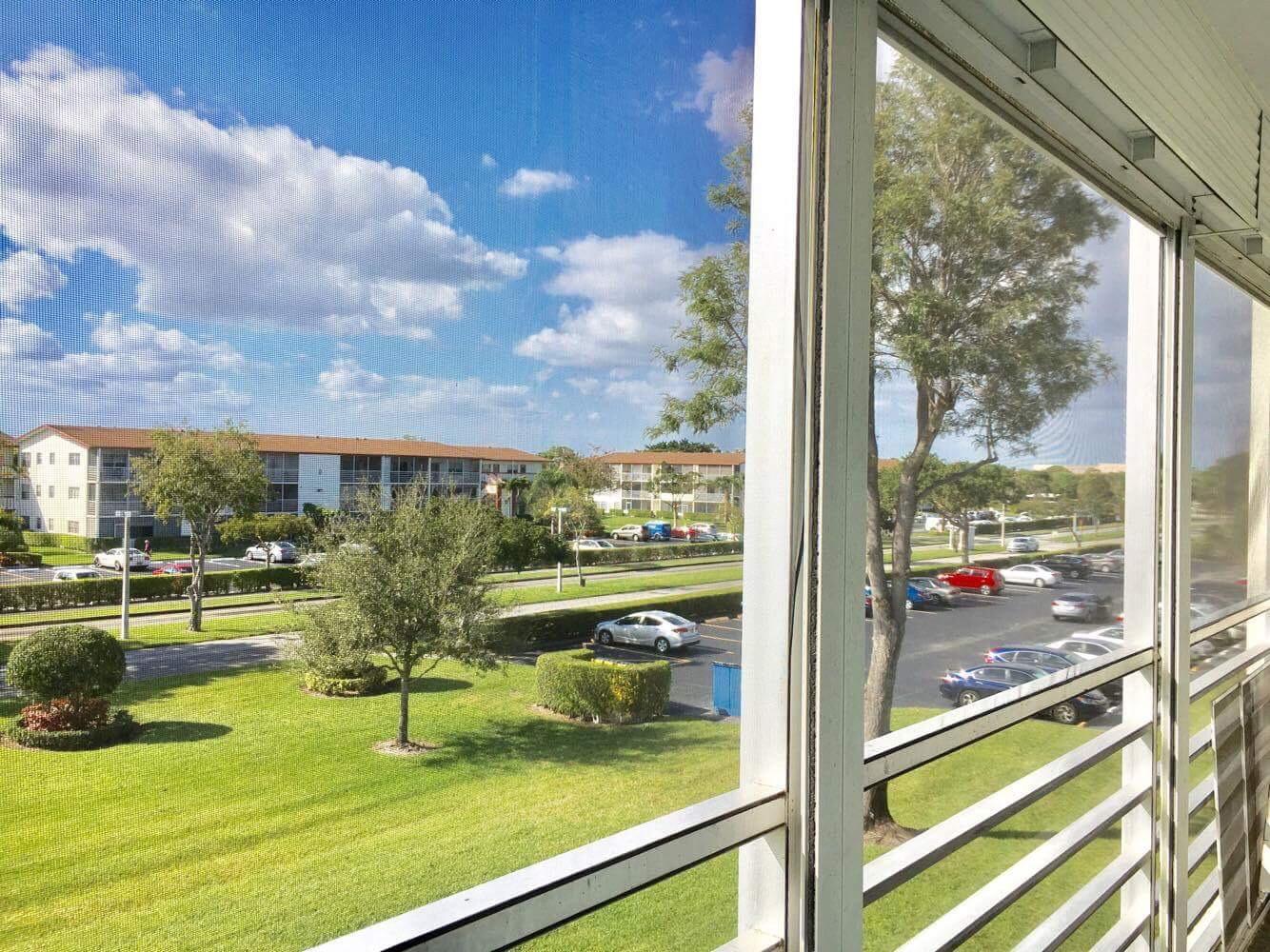 283 Brighton G Boca Raton, FL 33434 - Photo 11 of 11 Screened Patio w/pull downs