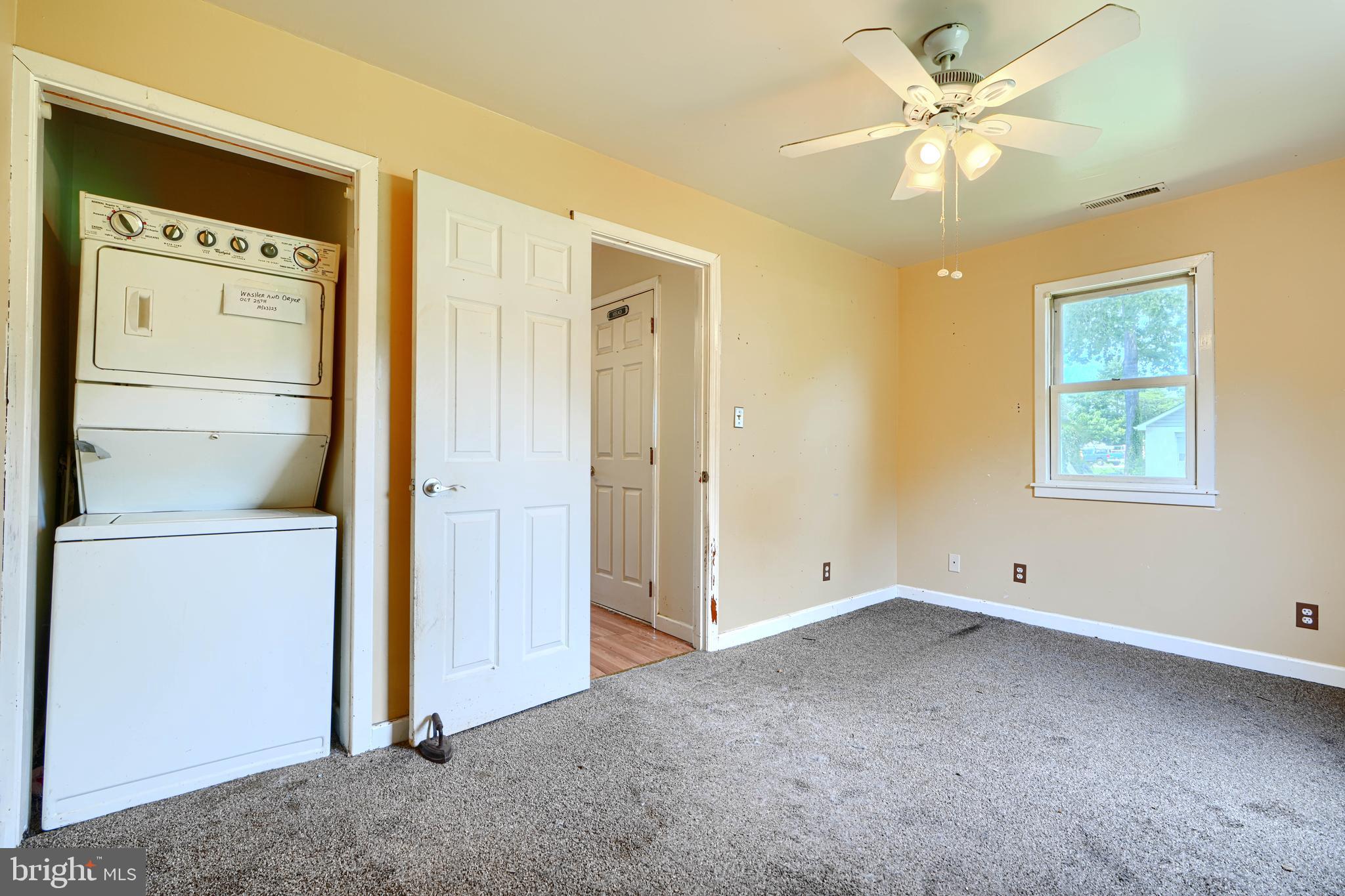 1702 Wilson Point Road Middle River, MD 21220 - Photo 13 of 32 an empty room with closet and a ceiling fan