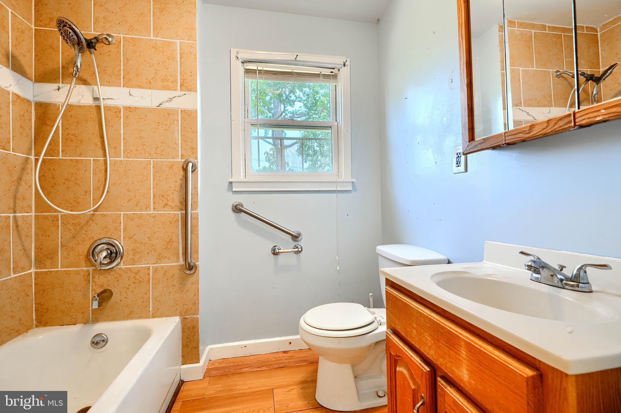 1702 Wilson Point Road Middle River, MD 21220 - Photo 15 of 32 a bathroom with a sink a toilet and shower