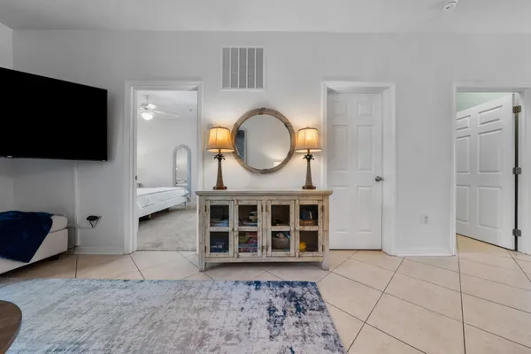 a view of a livingroom with furniture and a flat screen tv