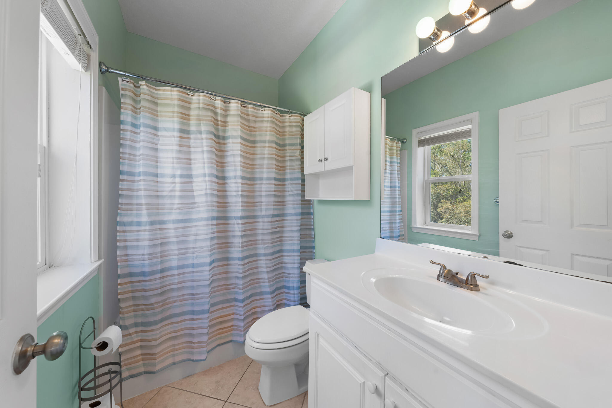 34 Heron's Watch Way, Unit 7205 Santa Rosa Beach, FL 32459 - Photo 23 of 49 a bathroom with a sink a toilet and shower curtain