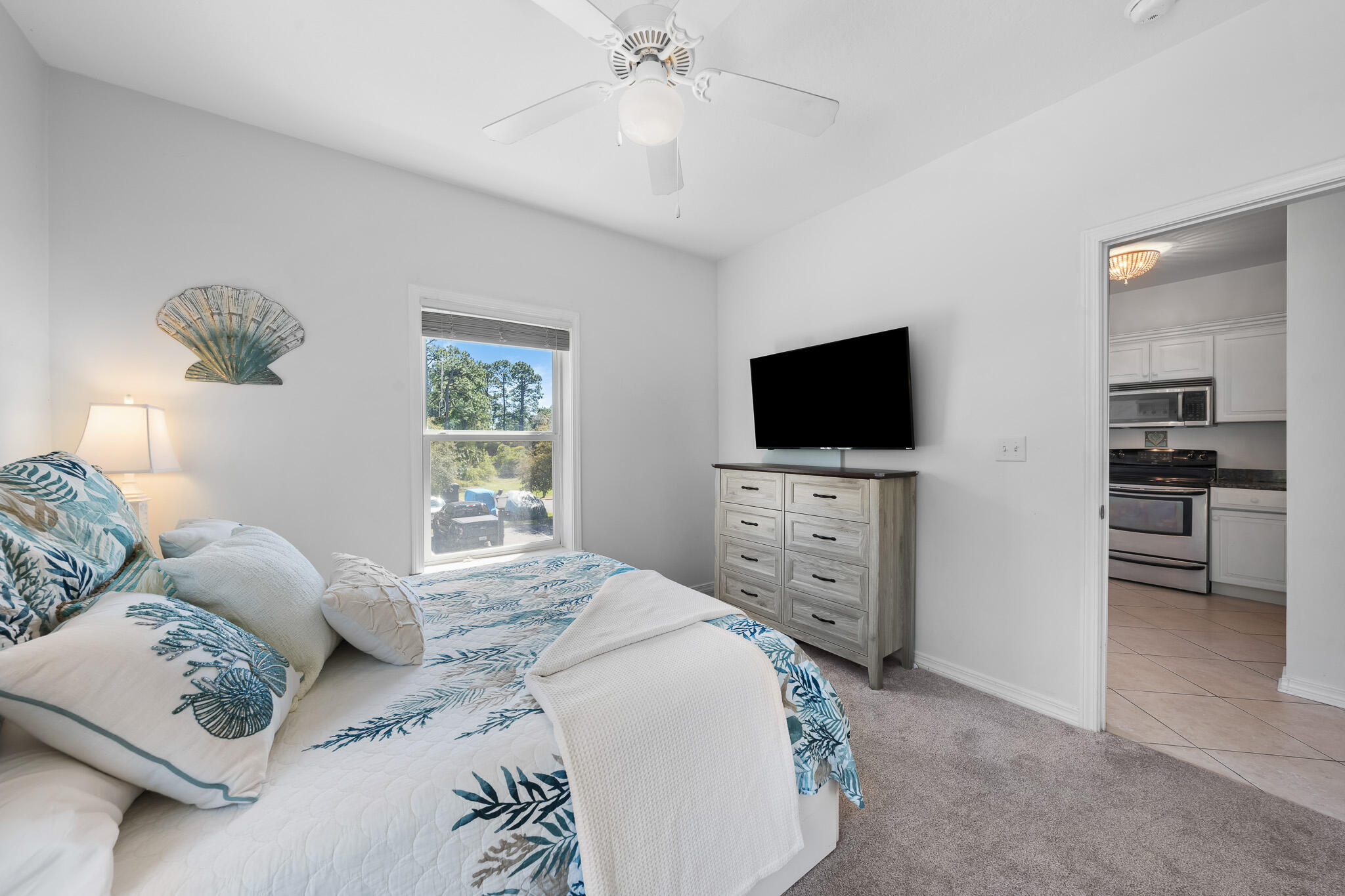 34 Heron's Watch Way, Unit 7205 Santa Rosa Beach, FL 32459 - Photo 26 of 49 a bedroom with furniture and a flat screen tv