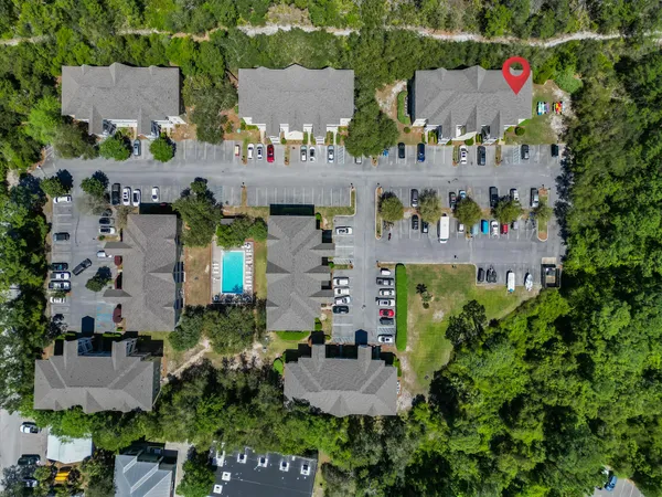 an aerial view of multiple houses with outdoor space