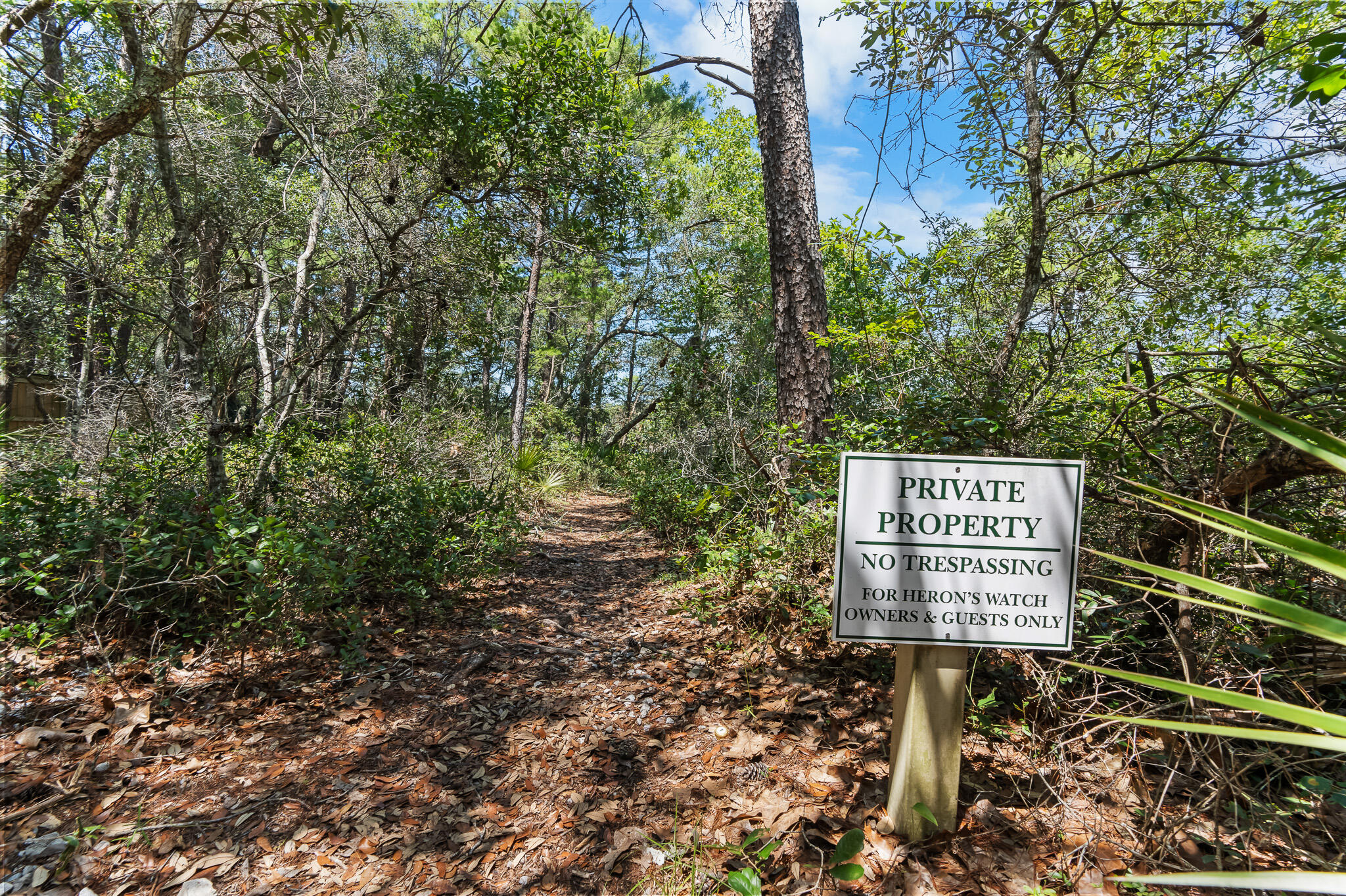 34 Heron's Watch Way, Unit 7205 Santa Rosa Beach, FL 32459 - Photo 38 of 49 a sign on the side of a road