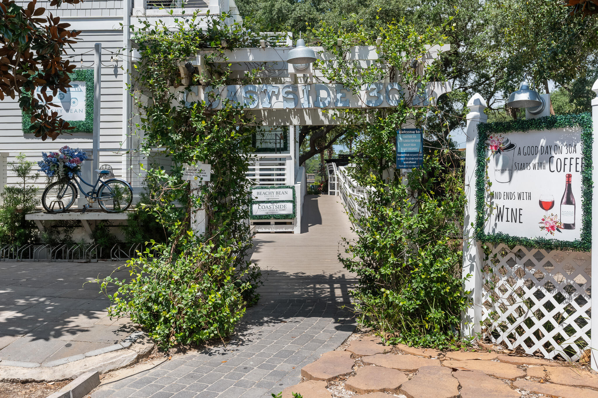 34 Heron's Watch Way, Unit 7205 Santa Rosa Beach, FL 32459 - Photo 46 of 49 a front view of a house with a garden