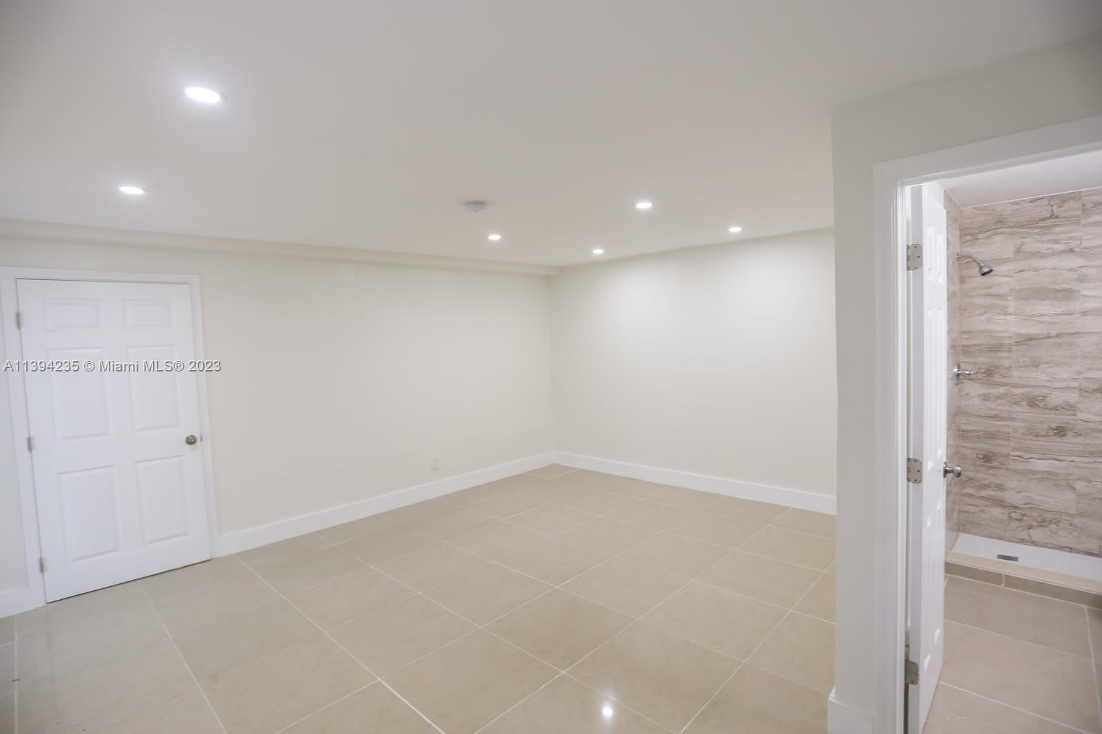 5410 Southwest 4th Street Miami, FL 33134 - Photo 13 of 23 an empty room with a empty space and windows