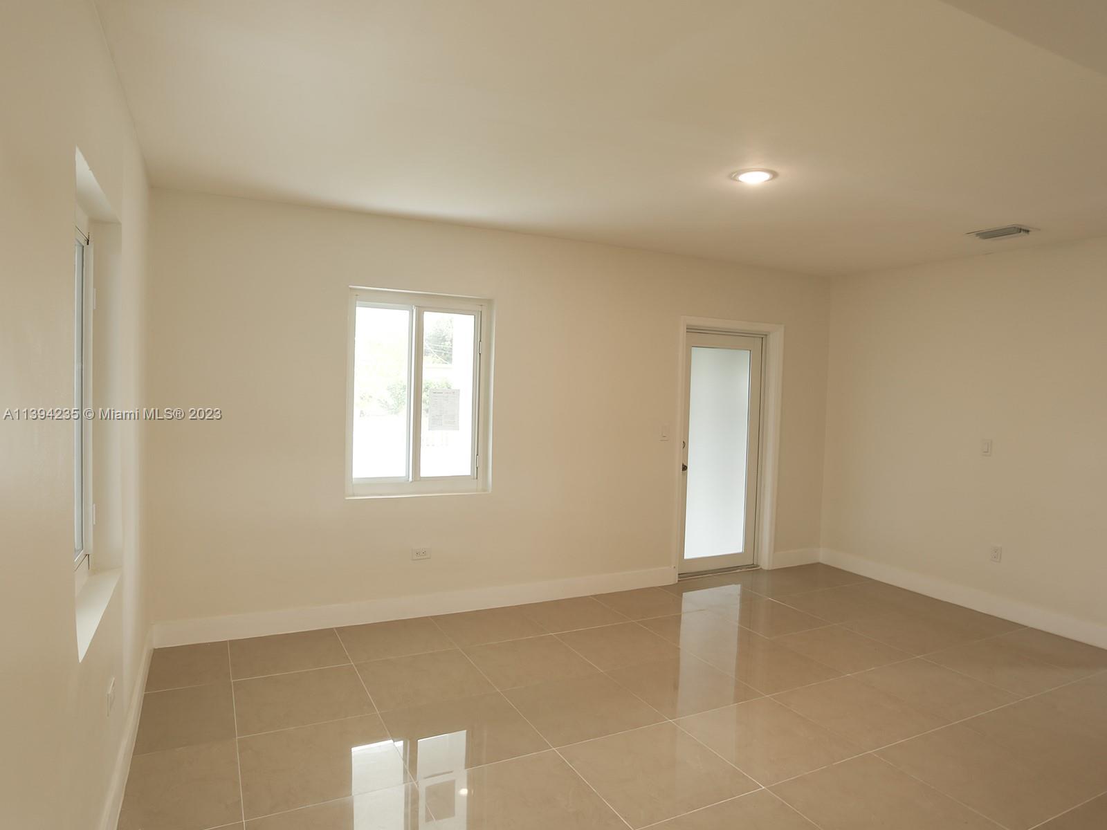5410 Southwest 4th Street Miami, FL 33134 - Photo 6 of 23 an empty room with windows
