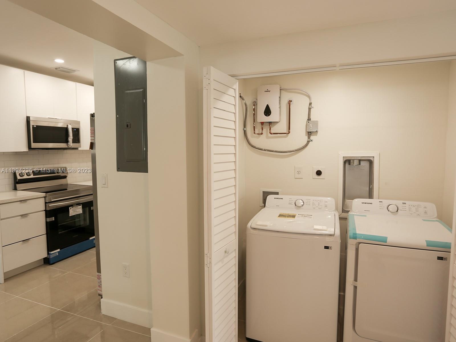 5410 Southwest 4th Street Miami, FL 33134 - Photo 8 of 23 a utility room with dryer and washer