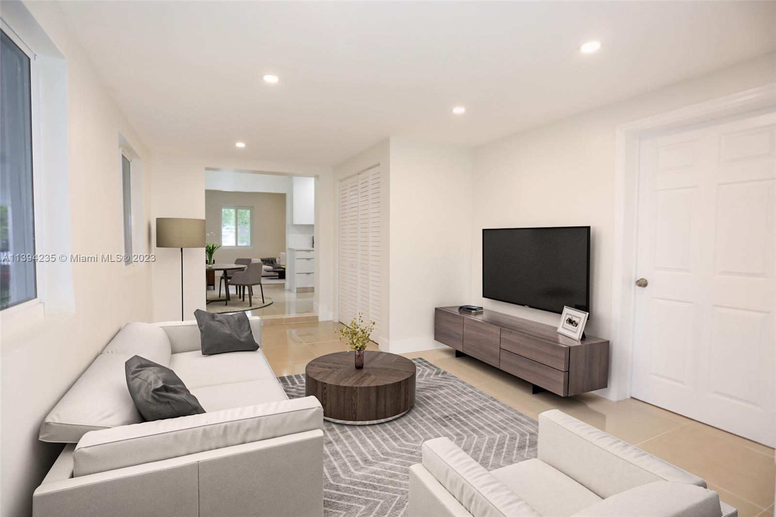 5410 Southwest 4th Street Miami, FL 33134 - Photo 9 of 23 a living room with furniture and a flat screen tv