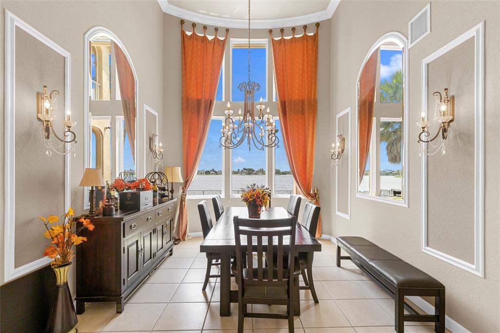 18932 Southwest 33rd Court Miramar, FL 33029 - Photo 13 of 97 a view of a dining room with furniture and chandelier