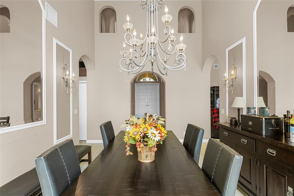 18932 Southwest 33rd Court Miramar, FL 33029 - Photo 14 of 97 a view of a dining room with furniture and chandelier