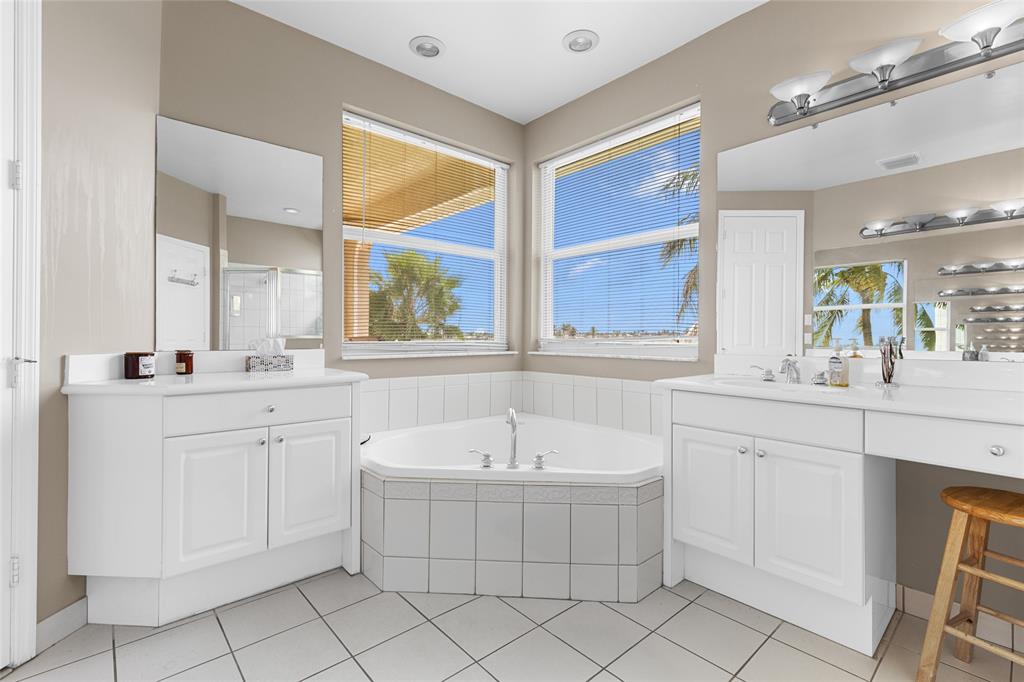 18932 Southwest 33rd Court Miramar, FL 33029 - Photo 22 of 97 a bathroom with a sink and a mirror